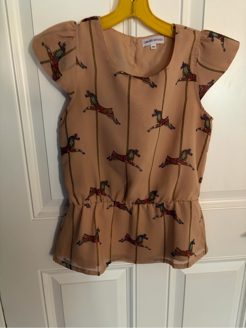 Woman’s Peach Carousel Horse Peplum Top